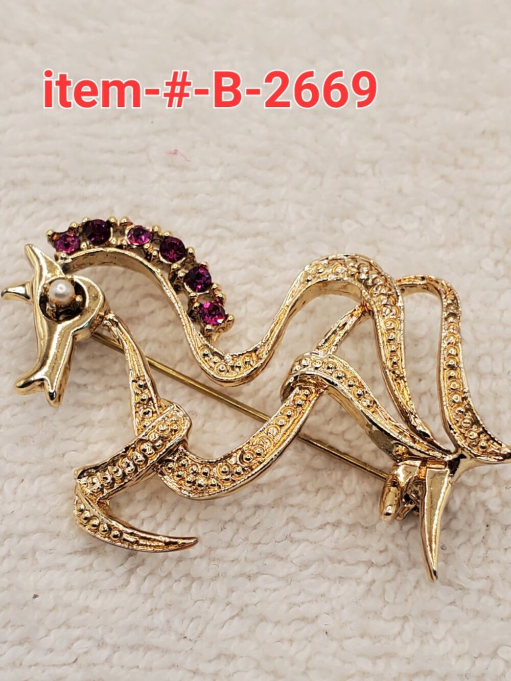 1 Brooch , item # B-2669,  wt.  10 grams.